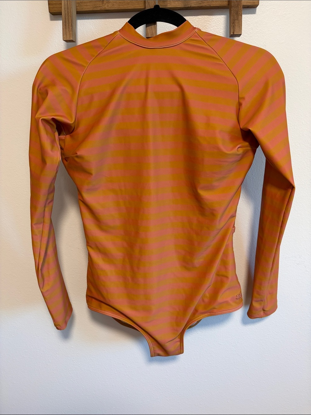Albion Women's Long Sleeve Open-Back One-Piece Swimsuit in Orange Stripe
